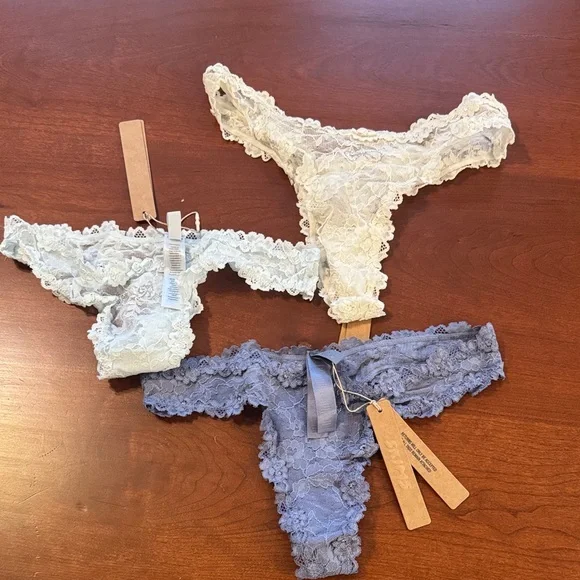 SKIMS Lace Thong Set in Cream, Light Blue, and Blue - Picture 1 of 3